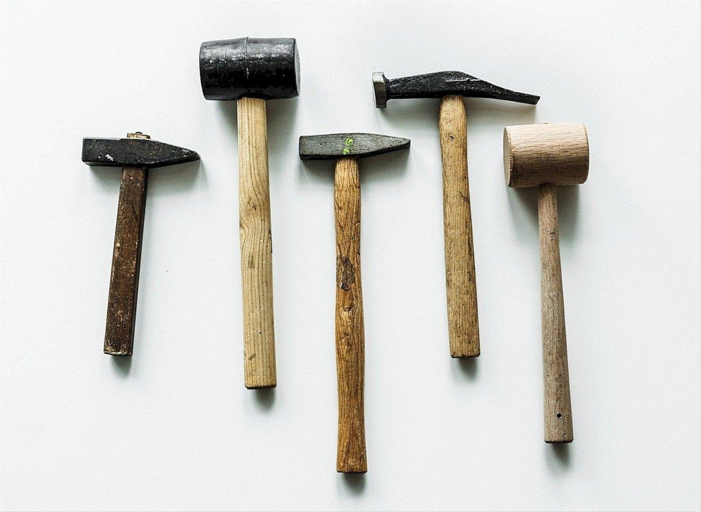 flat-lay-various-hammers-isolated-white-background.jpg