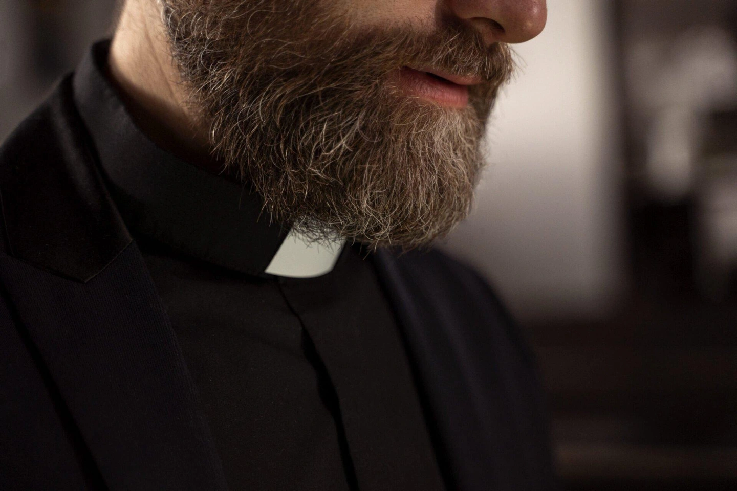close-up-priest-praying-scaled-1920x1280.jpg